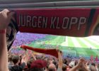 A scarf in front of the Anfield pitch with Jürgen Klopp's name on