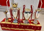 The premier league, champions league, club world cup and super cup trophies on display at anfield