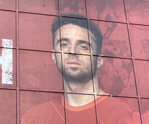 diogo jota's picture on the side of the kop with a red background