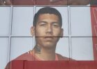 roberto firmino on the side of the kop in his liverpool shirt