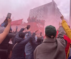 Players With The Trophies On The Parade Bus