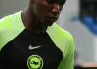moises caicedo in a bright green and black brighton training top