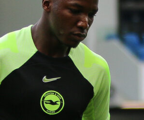 moises caicedo in a bright green and black brighton training top
