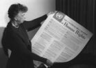 eleanor Roosevelt holding a copy of the universal declaration of human rights