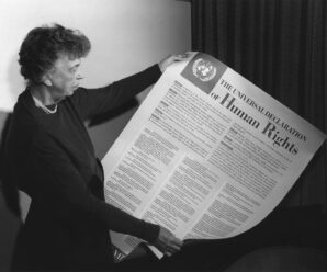 eleanor Roosevelt holding a copy of the universal declaration of human rights