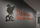 liverbird standing on top of 'lfc' letters with 'this is anfield we are liverpool' written in red next to it