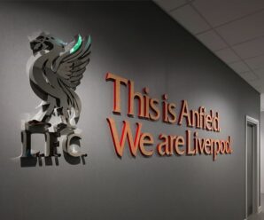 liverbird standing on top of 'lfc' letters with 'this is anfield we are liverpool' written in red next to it