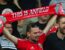liverpool supporter holds up a red card saying this is anfield