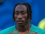 yan diomande wearing an ivory coast training top in front of a blue background